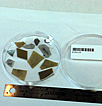 Closeup of 10 wafer fragments in a transparent dish