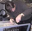 Igor Veryovkin performing equipment maintenance