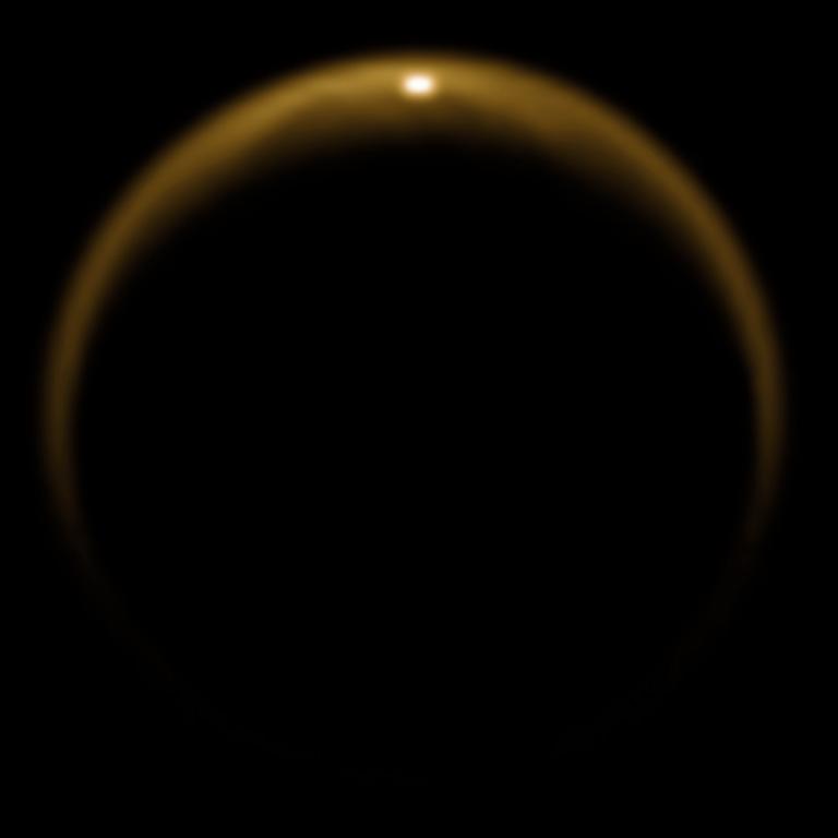 Sunlight reflection off the seas and lakes of Titan's North Pole.