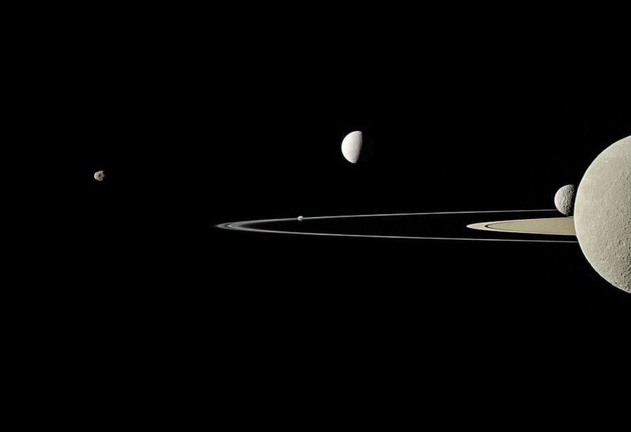 Five moons and Saturn's rings as seen from Cassini.