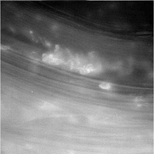 Black and white image of cloud ridges on Saturn.