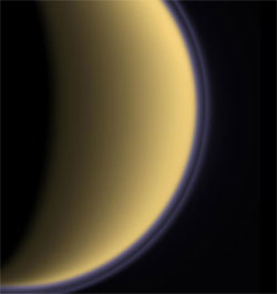 This false-color image shows a thin, detached haze layer (purple line) that appears to float above Titan's main atmospheric haze.