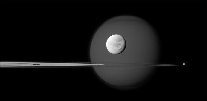 A quartet of Saturn's moons, from tiny to huge,