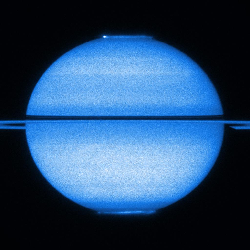 This unique image from NASA/ESA's Hubble Space Telescope from early 2009 features Saturn with the rings edge-on and both poles in view