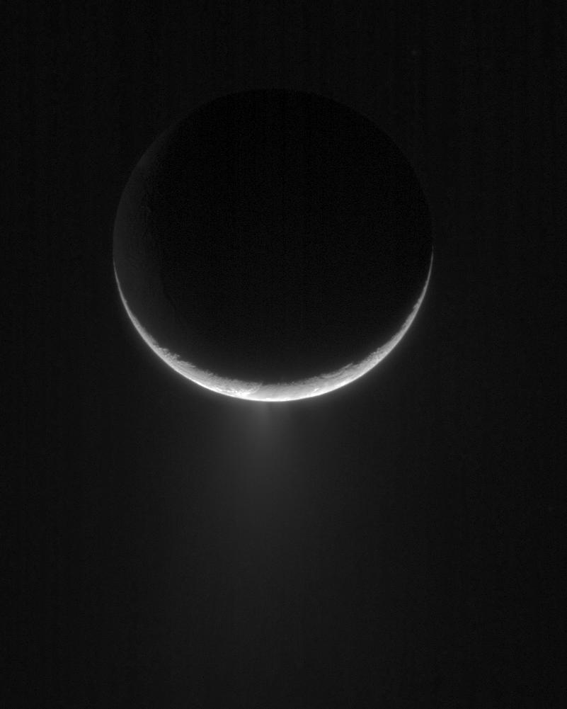 Plume of ice particles erupting from Enceladus' south polar region.