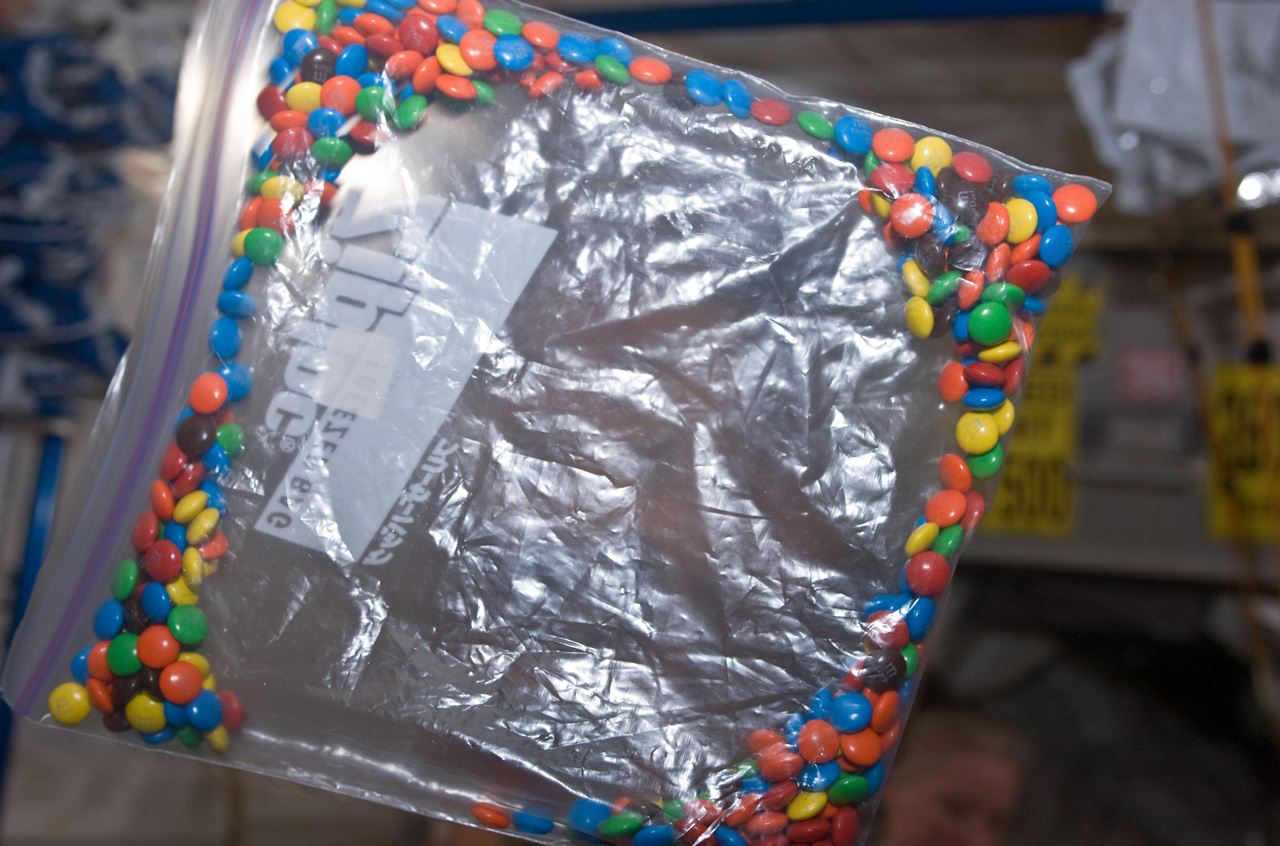 Candy in microgravity floats to the edges of the bag.
