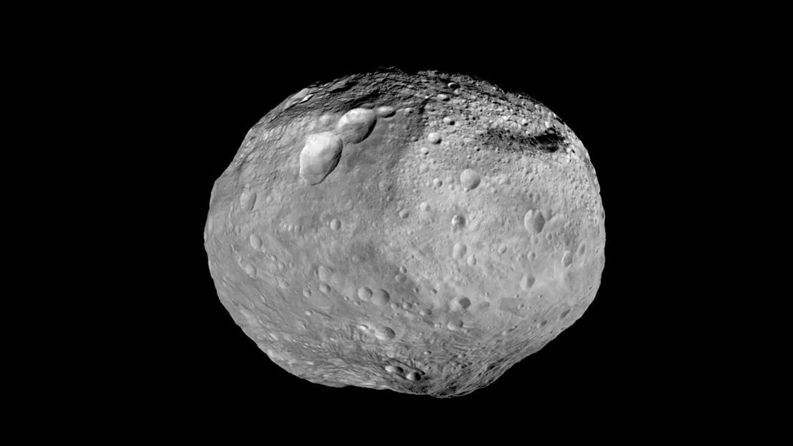 Full disk view of roundish asteroid