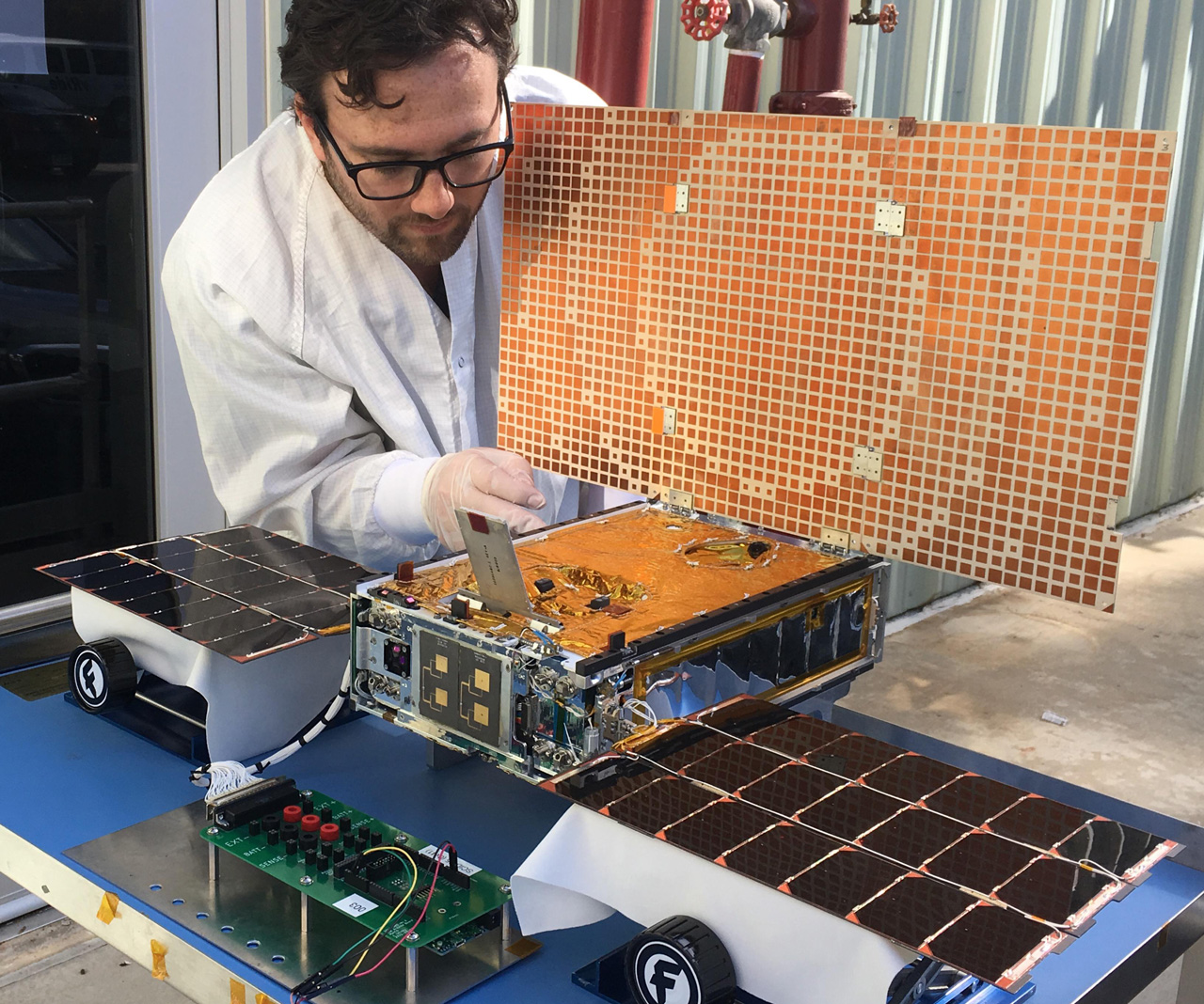 Engineer with MarCO spacecraft.