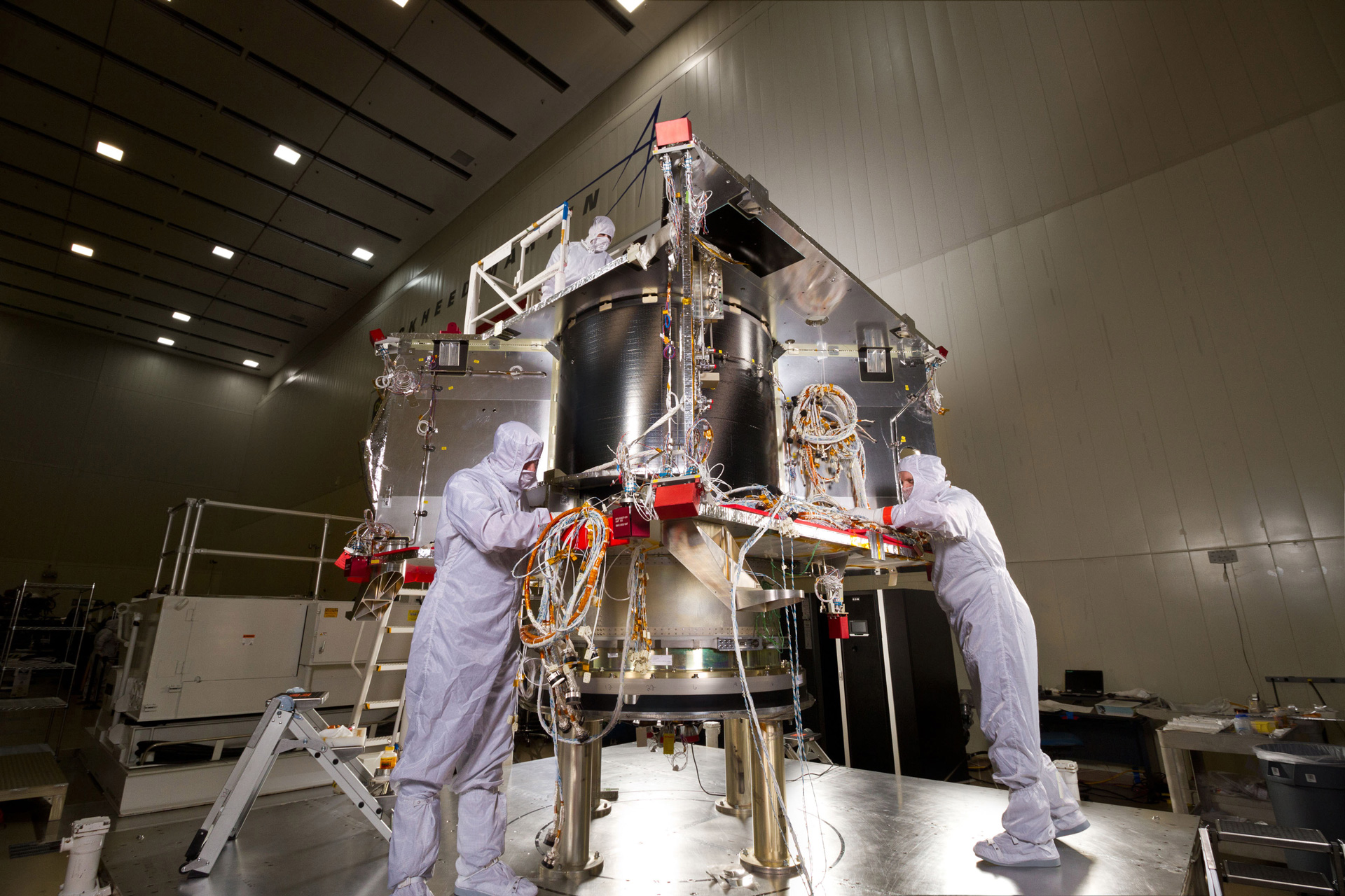 Engineers working on spacecraft.