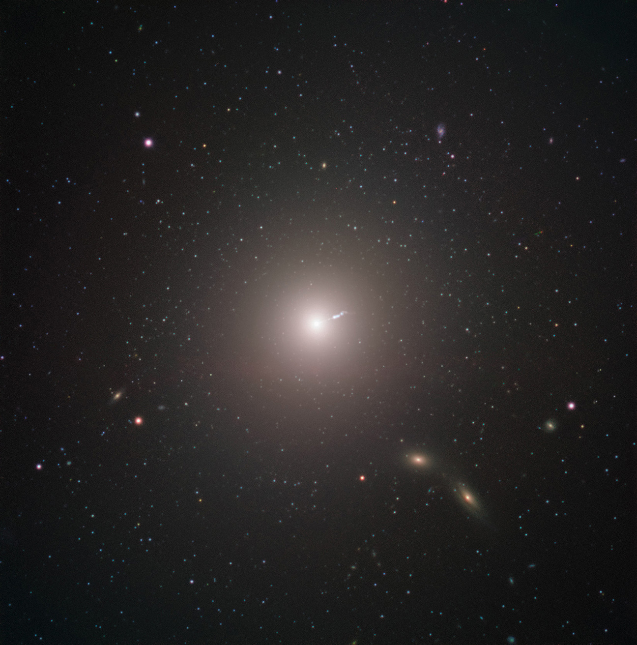 Image of galaxy with jet of light emerging