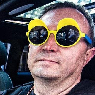 Chris Ratzlaff wearing funny round yellow glasses.