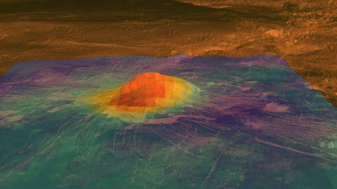 Radar image of a volcano on the surface of Venus with color enhancements to show areas of heat near the summit.