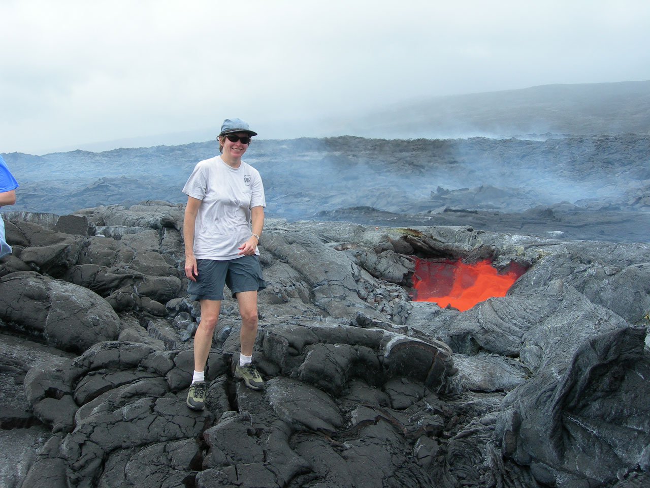 Sue Smrekar standing next to active volcano vent