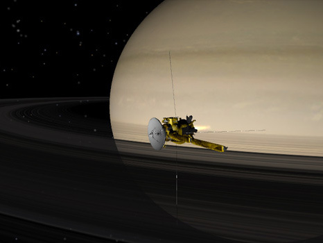 Image of Cassini spacecraft flying by Saturn