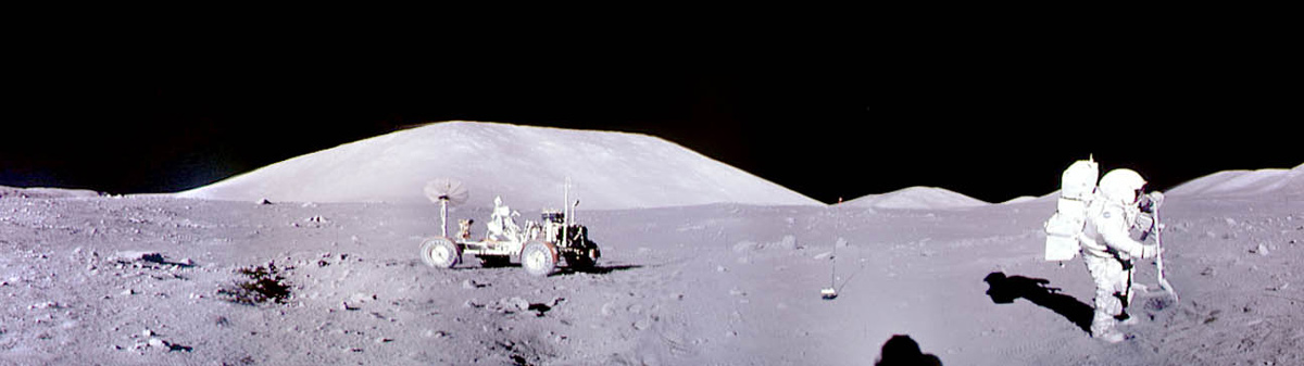 Panoramic image of an Apollo astronaut preparing to shovel a soil sample from the lunar surface, with a rover nearby. 