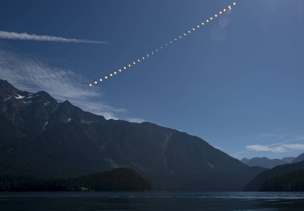 progression of a solar eclipse shown by overlaying photos taken throughout the eclipse