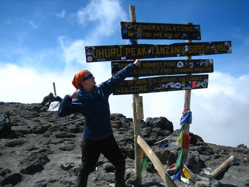 Photo of Morgan Cable on top of Mount Kilimanjaro.