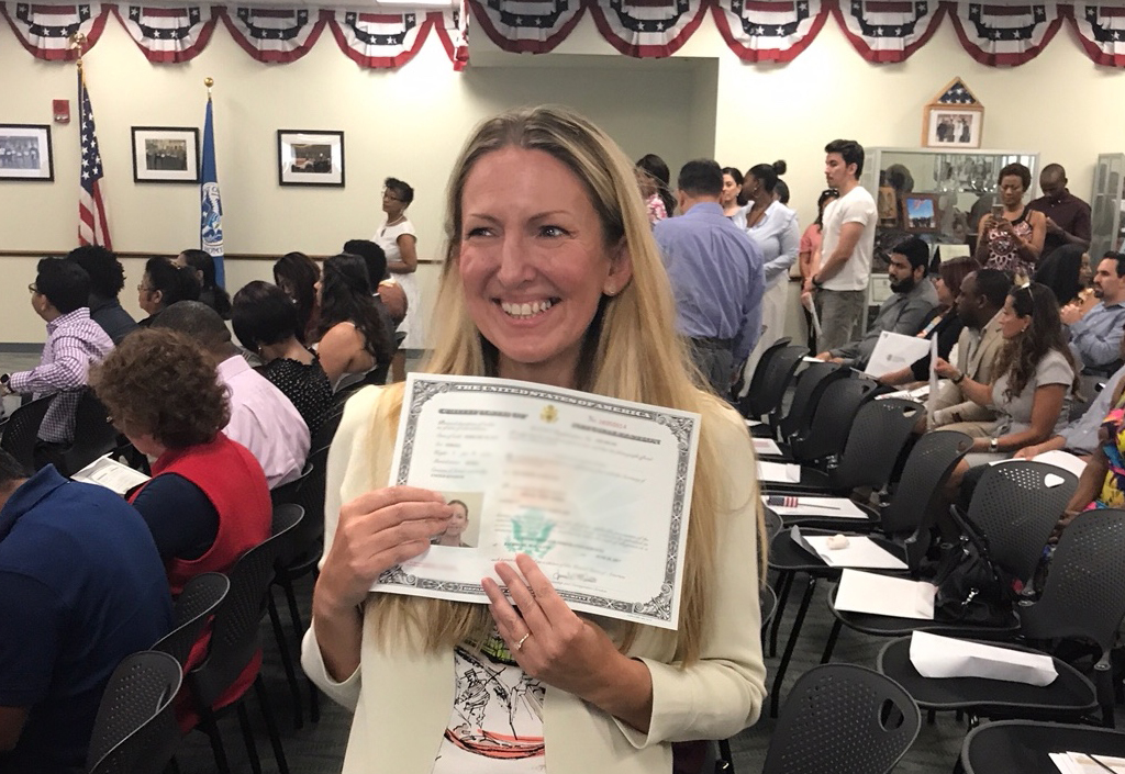 Woman getting U.S. citizenship certificate