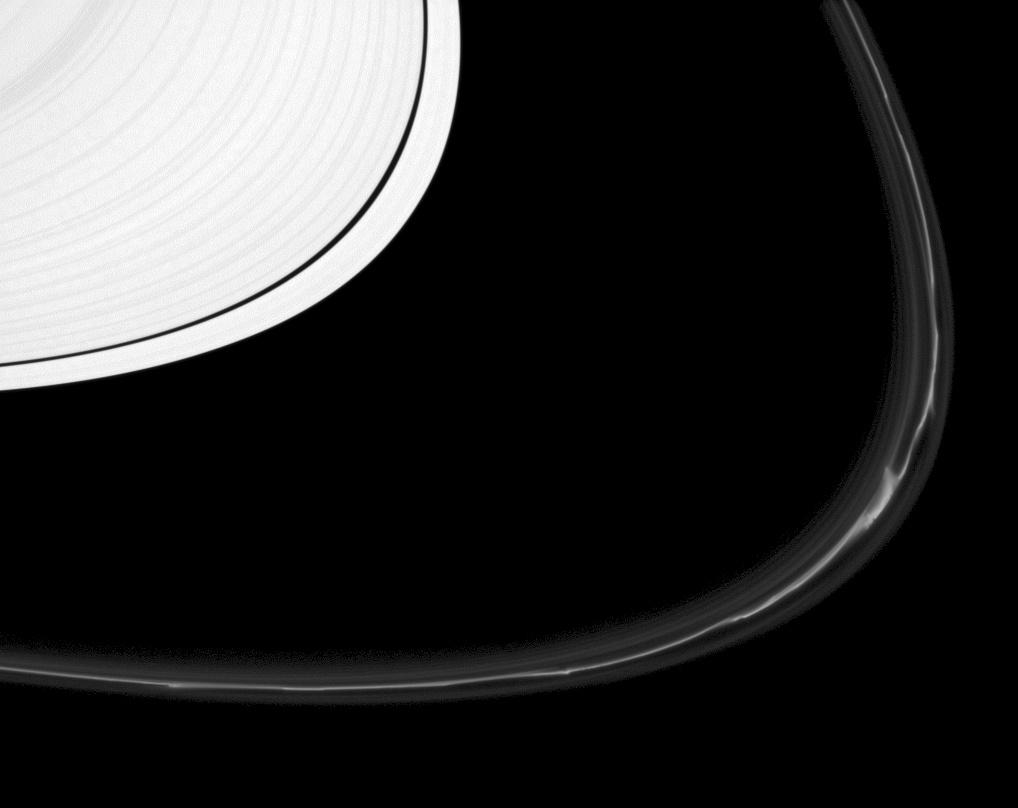 The F ring shows off a rich variety of phenomena in this image from the Cassini spacecraft.