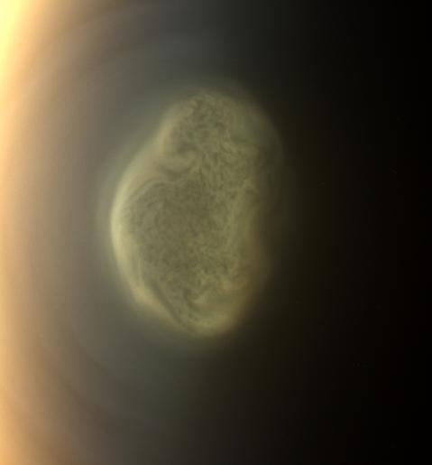 This true color image captured by NASA'S Cassini spacecraft before a distant flyby of Saturn's moon Titan on June 27, 2012, shows a south polar vortex, or a swirling mass of gas around the pole in the atmosphere.