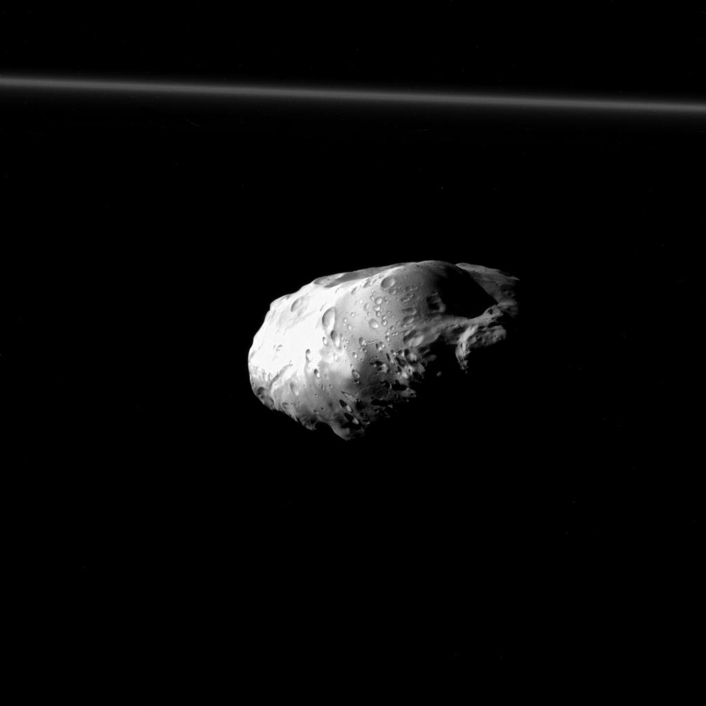 NASA's Cassini spacecraft spied details on the pockmarked surface of Saturn's moon Prometheus (86 kilometers, or 53 miles across) during a moderately close flyby on Dec. 6, 2015.