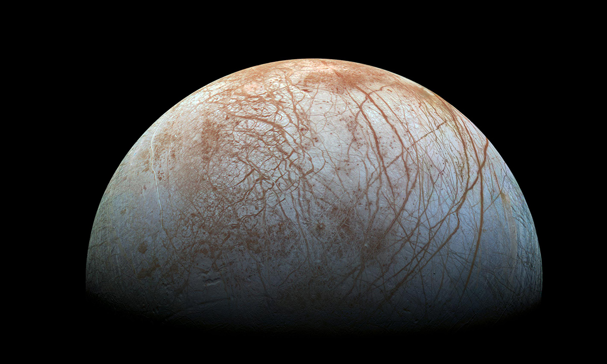 The puzzling, fascinating surface of Jupiter's icy moon Europa looms large in this newly-reprocessed color view, made from images taken by NASA's Galileo spacecraft in the late 1990s.