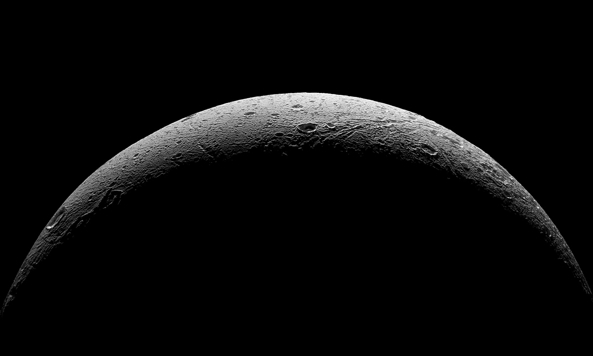 NASA's Cassini spacecraft captured this parting view showing the rough and icy crescent of Saturn's moon Dione following the spacecraft's last close flyby of the moon on Aug. 17, 2015.