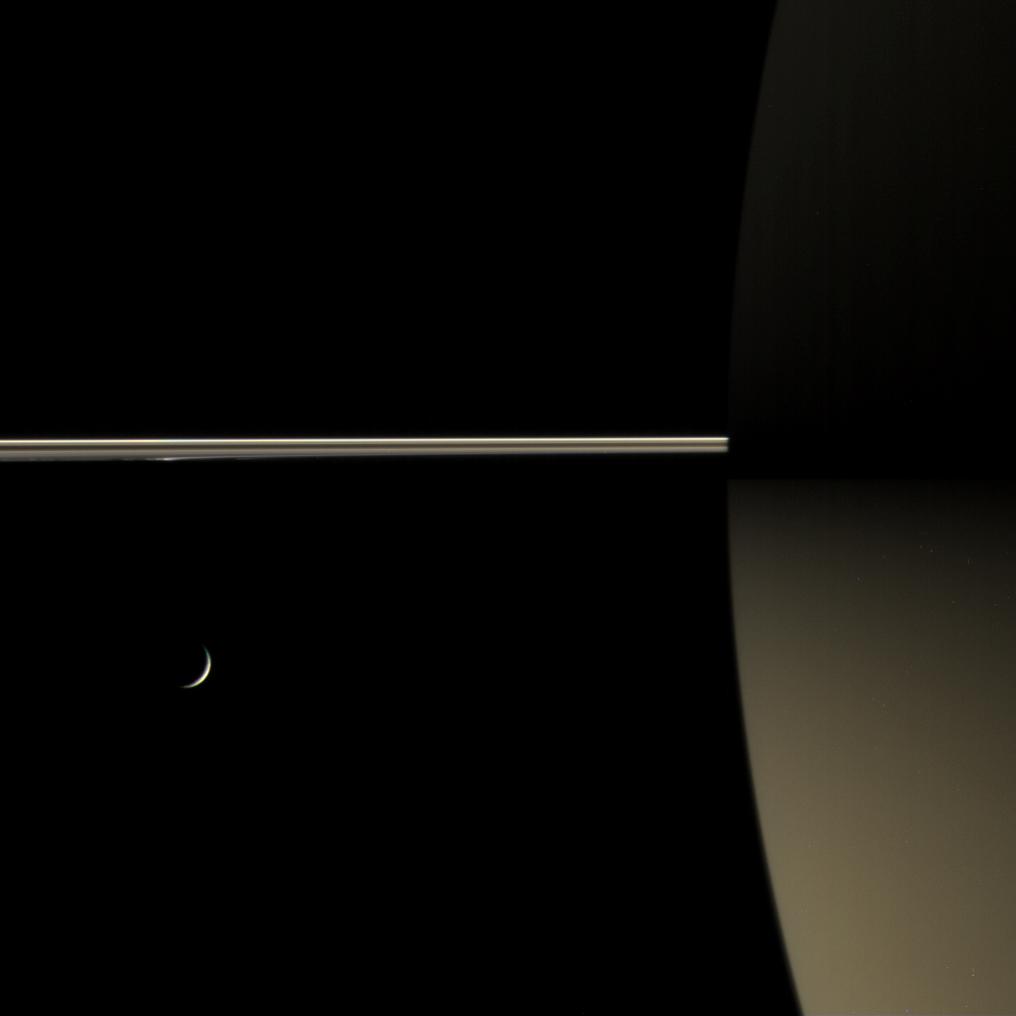 This color view of Saturn's night side shows how the rings dimly illuminate the southern hemisphere