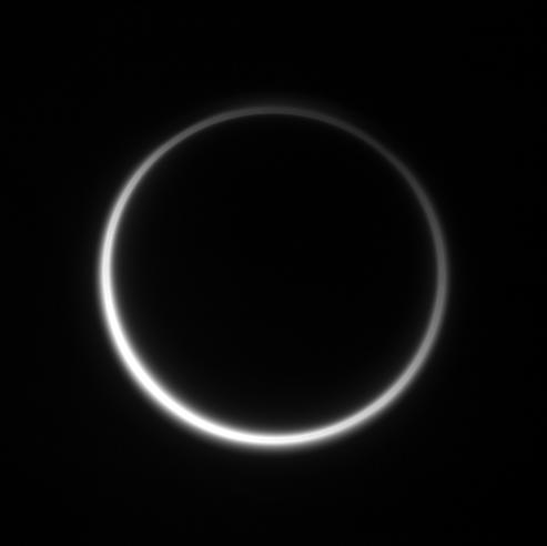 Titan's murky atmosphere shines as a halo of scattered light
