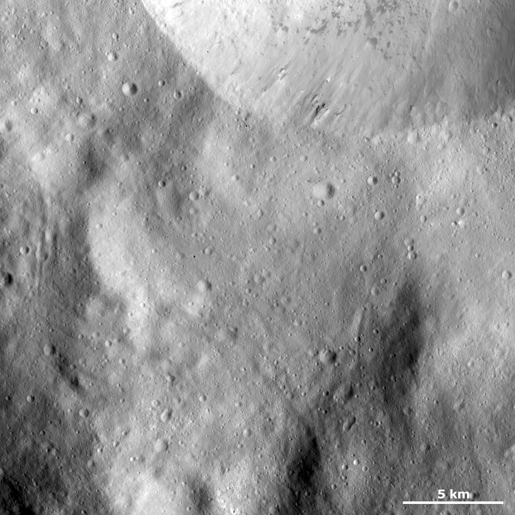 Sharp Crater Rim with Dark Material and Boulders