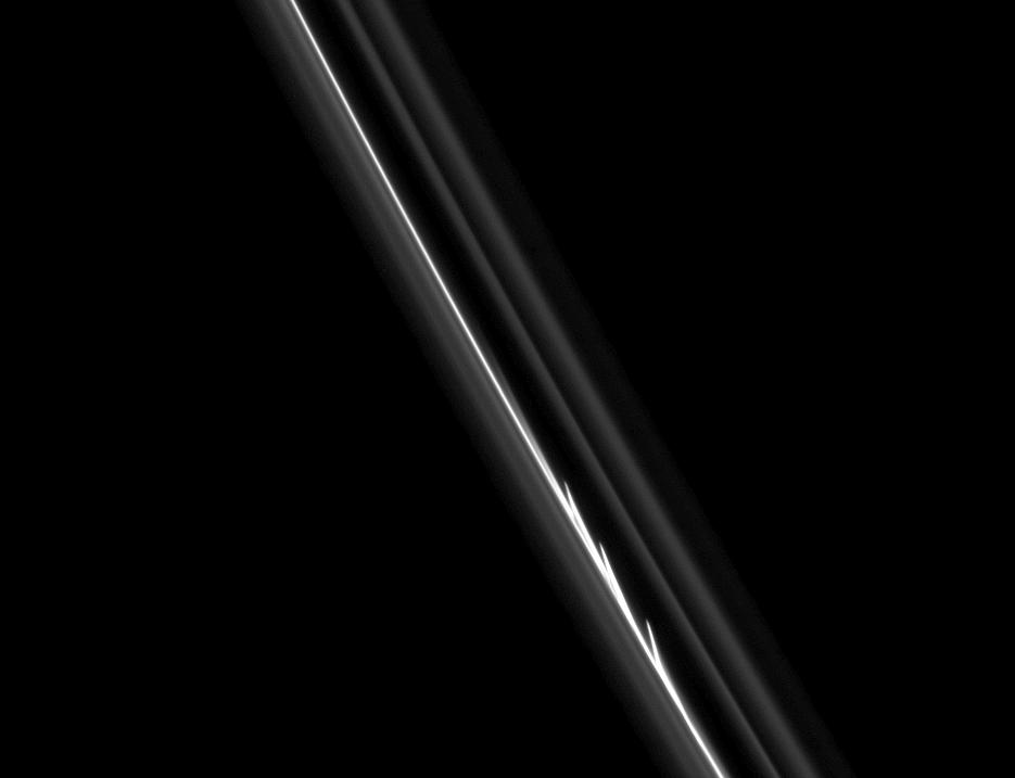 The three bright, finger-like jets of material in Saturn's F ring.