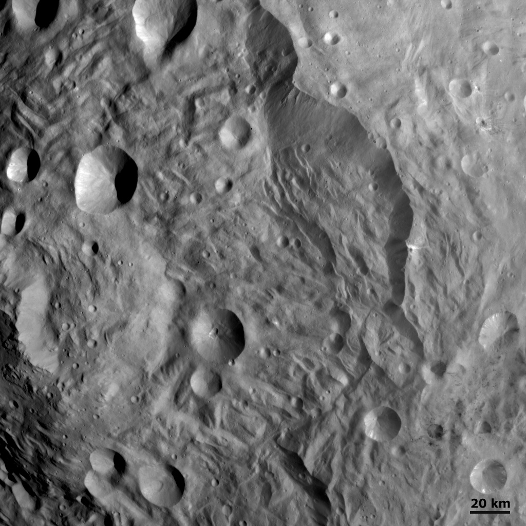 Scarps, Hummocky Terrain and Impacts at Vesta's South Pole