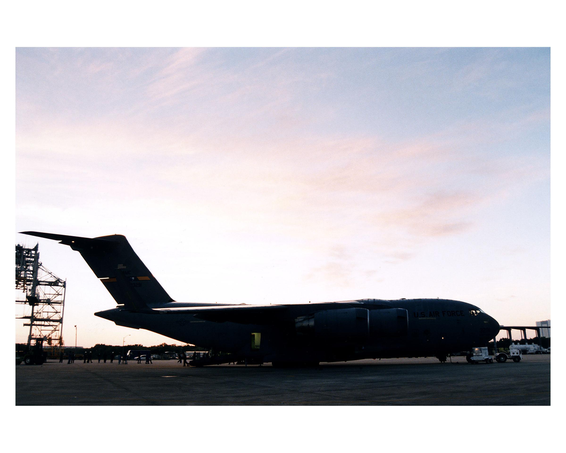 Color picture of airplane on runway.
