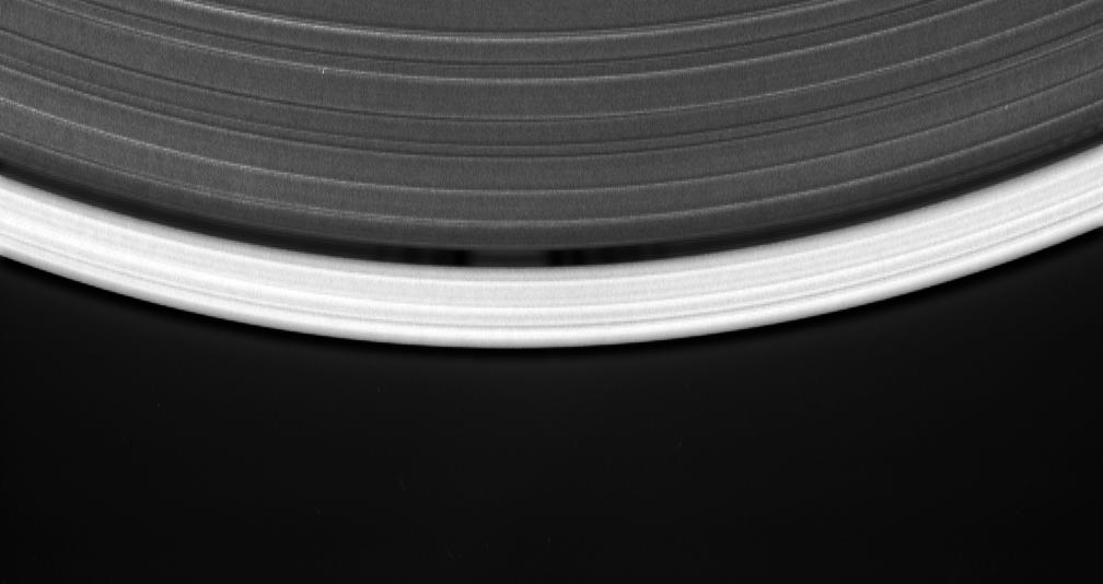 This movie sequence consists of 12 images taken over 16 minutes while Cassini gazed down upon the sunlit side of the A ring, shows a tiny moon orbiting in the center of the Keeler gap, churning up waves in the gap edges as it goes.