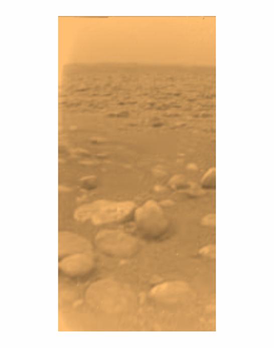Color image of Titan's surface, showing rock-like objects
