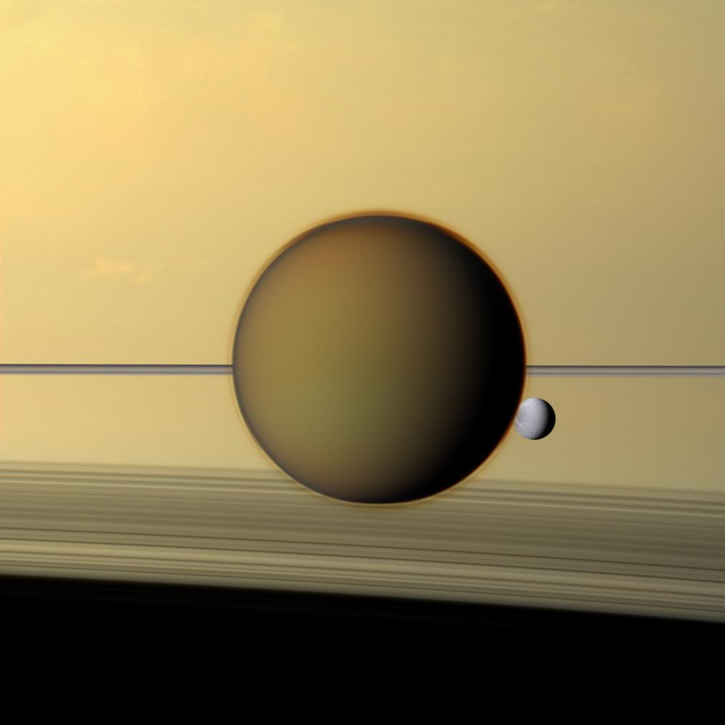 Natural color image of Titan and Dione in front of Saturn's rings