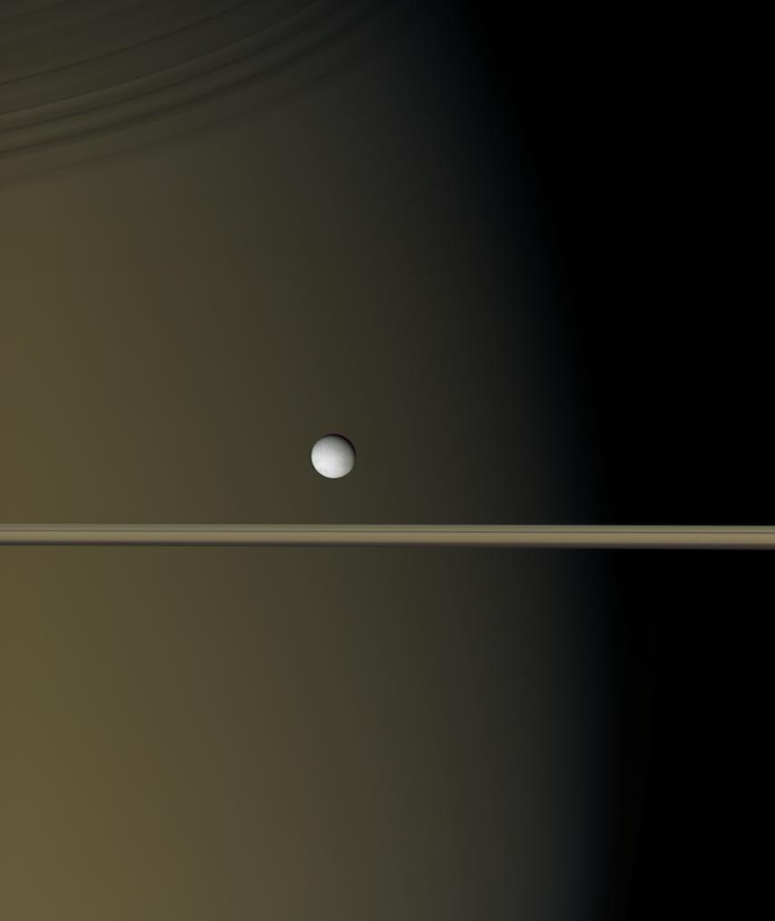 Enceladus by Saturn and the rings