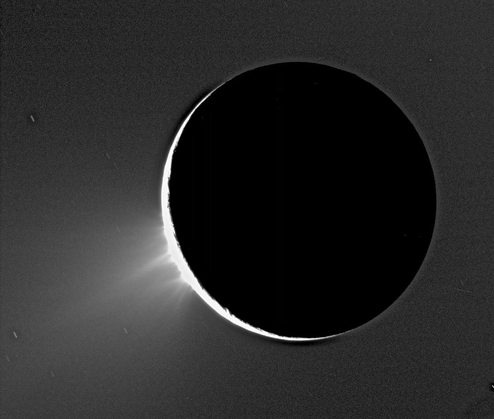 Enceladus backlit, showing foutain-like sources of fine spray