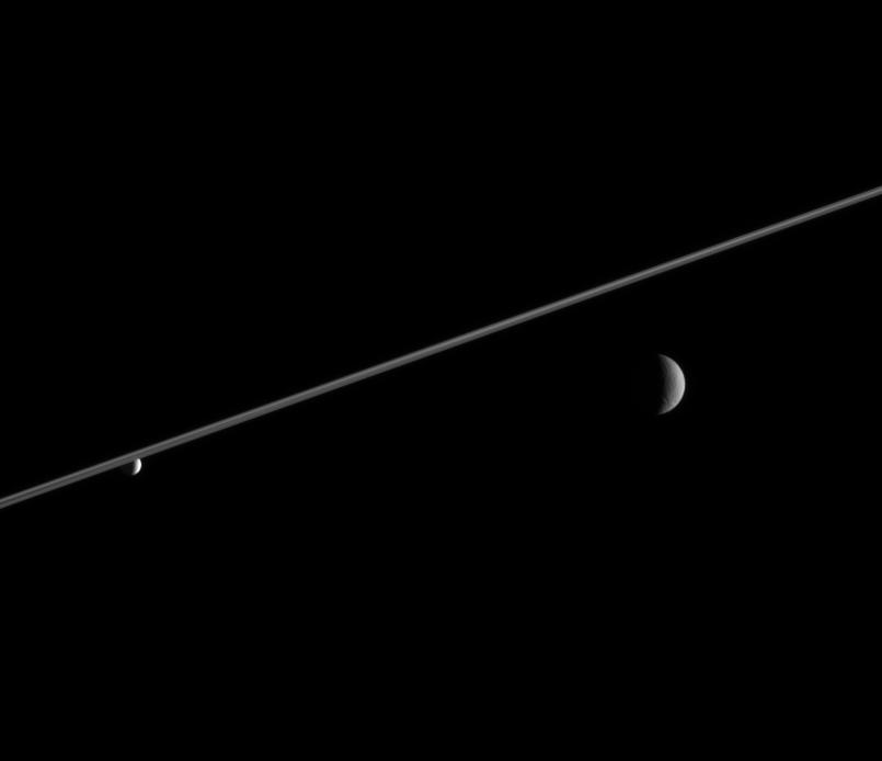 Rhea, Enceladus and a portion of Saturn's rings