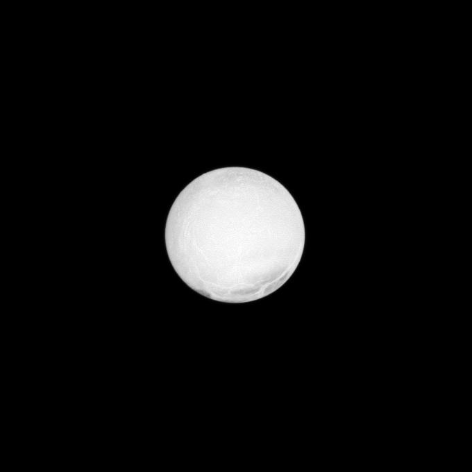 The highly reflective surface of Saturn's moon Enceladus is almost completely illuminated in this Cassini spacecraft image taken at a low phase angle.