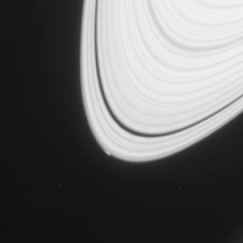 The disturbance visible at the outer edge of Saturn's A ring