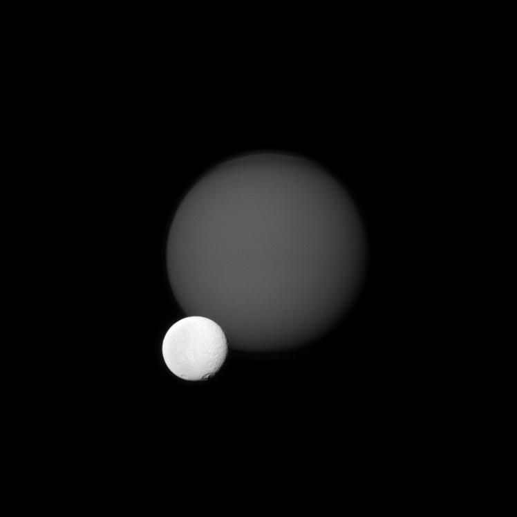 Tethys in front of Titan