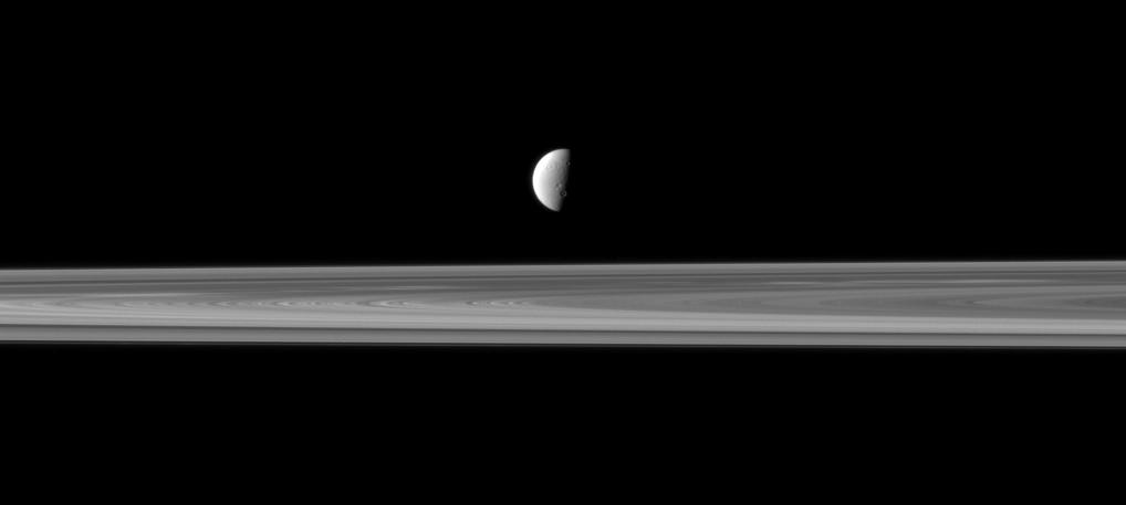 Dione and Saturn's rings