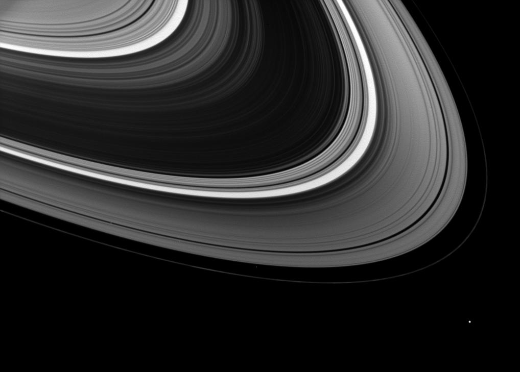 At first glance, it seems Epimetheus is the lone moon orbiting Saturn in this image, but a closer inspection reveals a couple of companions in the rings.
