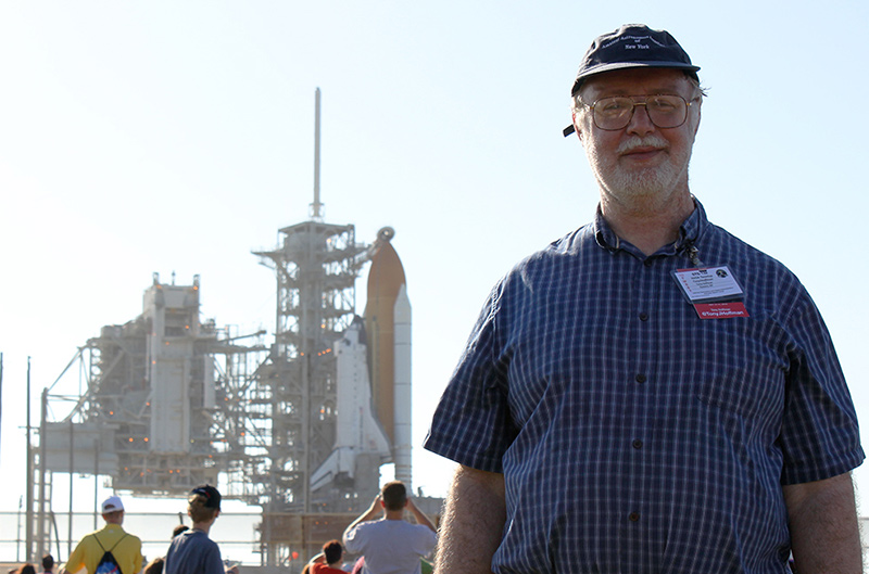 Tony with a Space Shuttle on the pad behind him.