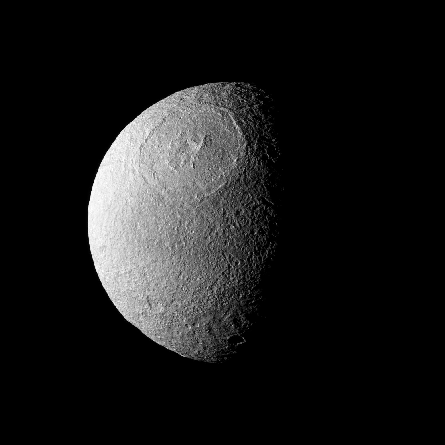 Odysseus Crater stretches across a large northern expanse on Tethys.