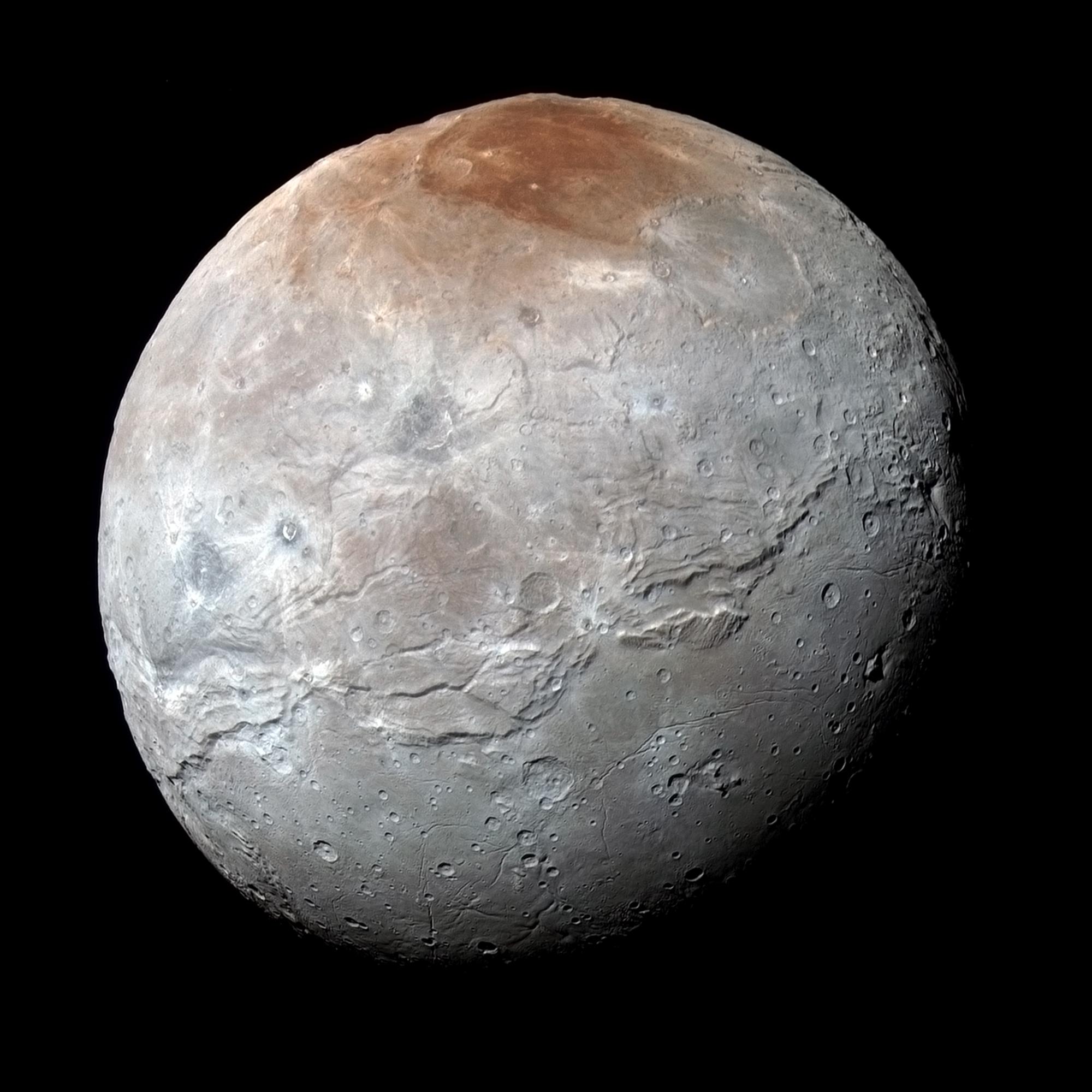 Enhanced color image showing surface details of moon Charon.