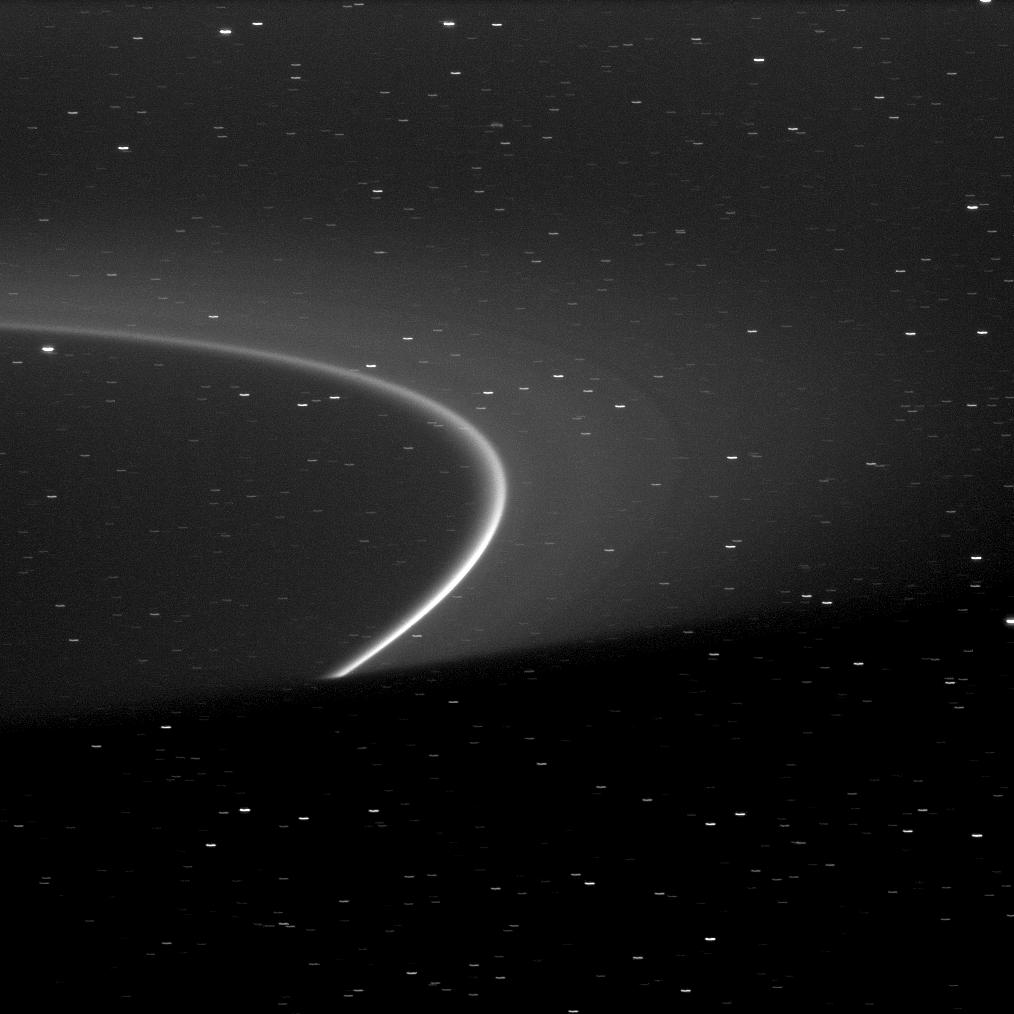 The bright arc within Saturn's G ring is shown truncated by the shadow of the planet