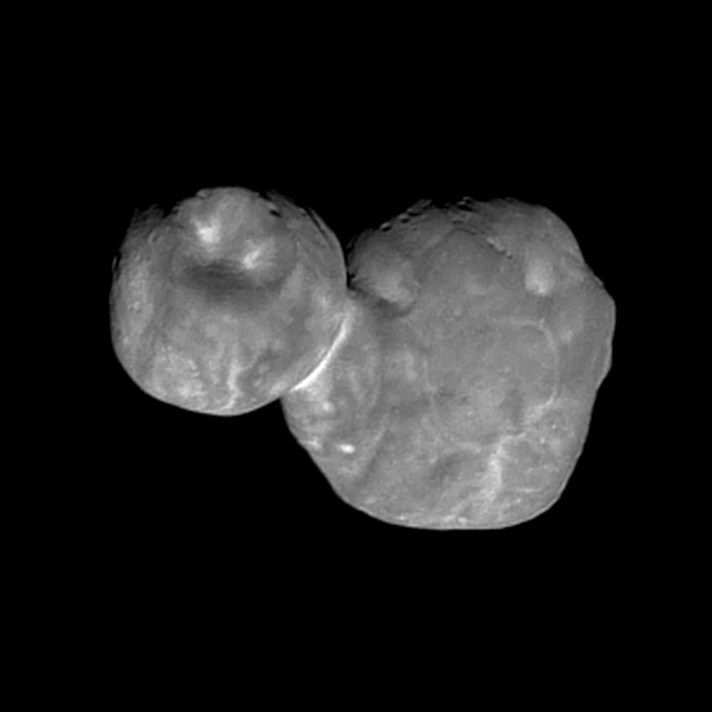 black and white view of two-lobed object in dark space 
