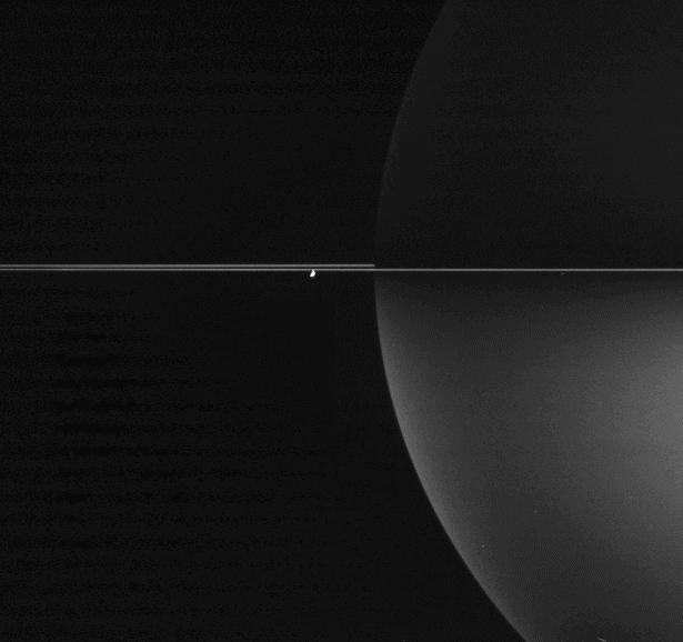 Saturn and a nearly edge-on view of the rings, along with Enceladus